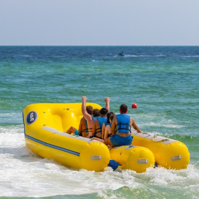 a group of people in a banana boat