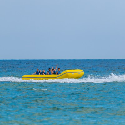 a group of people in a banana boat