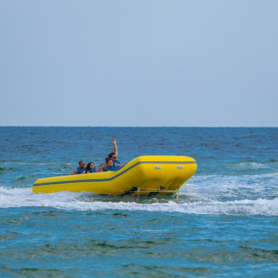 a group of people in a banana boat