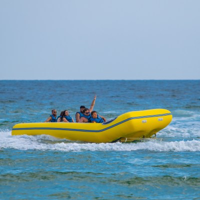 a group of people in a banana boat