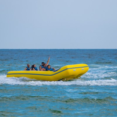 a group of people in a banana boat