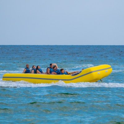 a group of people in a banana boat