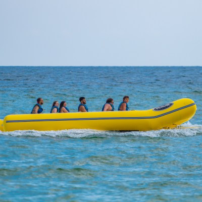 a group of people in a banana boat