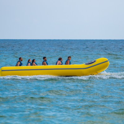 a group of people in a banana boat