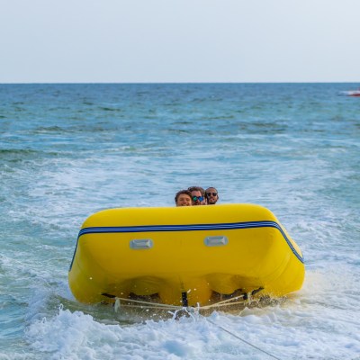 a group of people in a banana boat