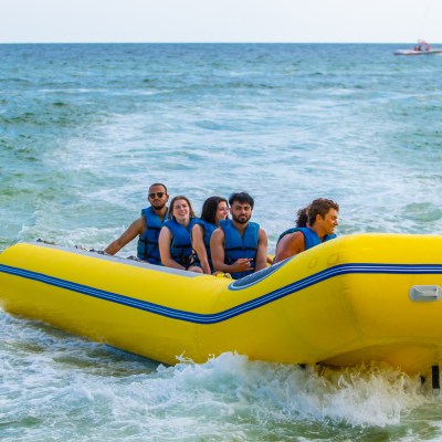 a group of people in a banana boat